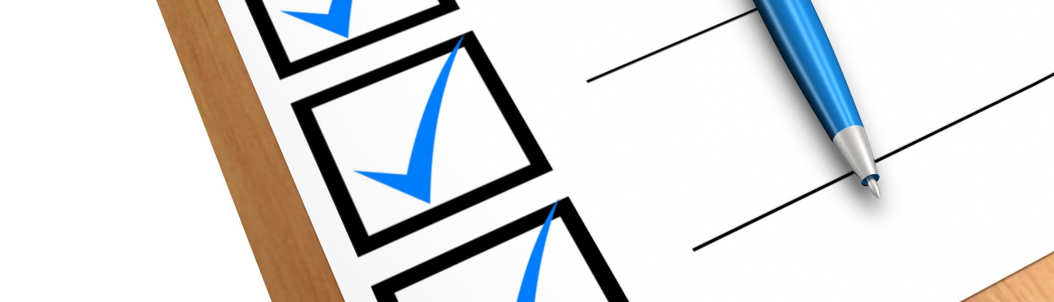 Checklist and pen - representing research quality assurance at the University of Reading