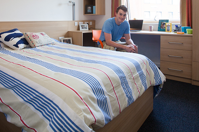 Student in a townhouse bedroom