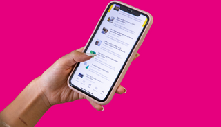 Pink graphic, close up of student using UoR Student app